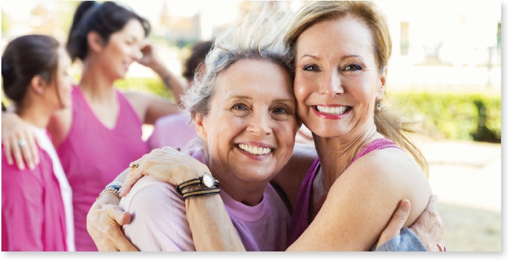 Smiling women in a caring embrace