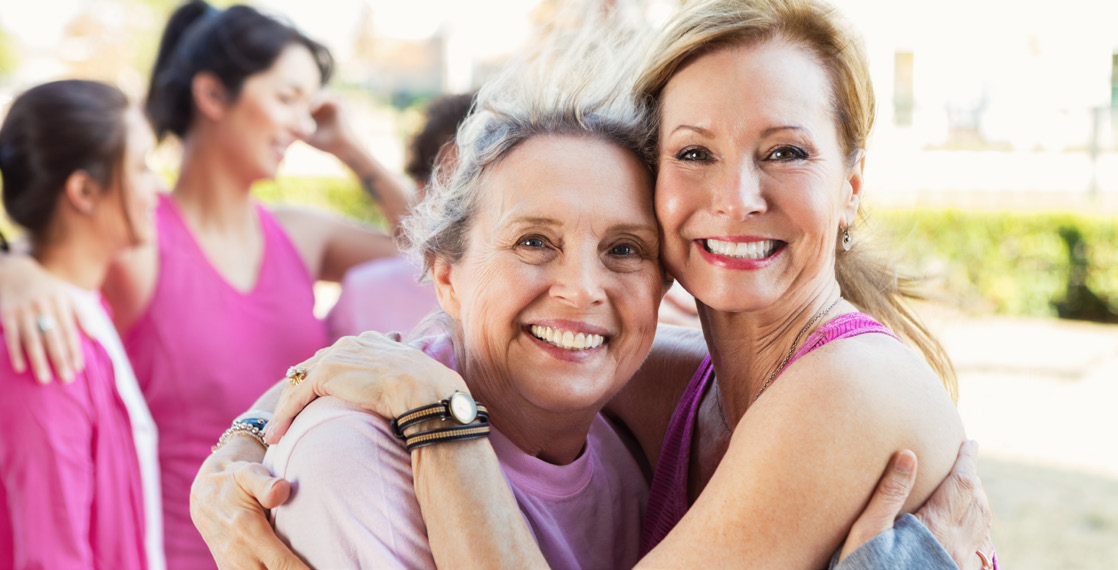 Smiling women in a caring embrace
