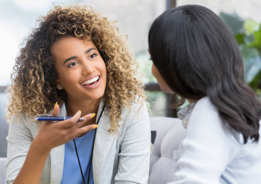 Provider engaged in conversation with another woman